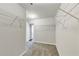 Spacious walk-in closet featuring wire shelving for ample storage and organization in a neutral color palette at 7104 Skippingstone Way, Douglasville, GA 30134