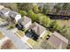 An aerial view shows the home's position on a tree-lined street in a neighborhood at 7382 Gossamer St, Union City, GA 30291