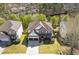 Aerial view of a two-story home showcasing the roof and surrounding greenery at 7382 Gossamer St, Union City, GA 30291