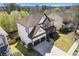 Aerial view of the home featuring an attached two-car garage and front lawn at 7382 Gossamer St, Union City, GA 30291