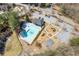 Aerial view of a neighborhood pool and playground next to parking and neighborhood streets at 7382 Gossamer St, Union City, GA 30291