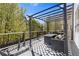 Cozy outdoor deck with a pergola and outdoor seating for relaxing and entertaining at 7382 Gossamer St, Union City, GA 30291