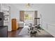 Bright exercise room with hardwood floors and plenty of space for workout equipment at 7382 Gossamer St, Union City, GA 30291
