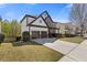 Inviting home exterior with a spacious driveway, attached two-car garage, and manicured lawn at 7382 Gossamer St, Union City, GA 30291