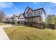 Attractive home featuring a well-maintained lawn and a two-car garage, complemented by neat landscaping at 7382 Gossamer St, Union City, GA 30291