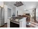 Contemporary kitchen with stainless steel appliances and open layout to dining area at 7382 Gossamer St, Union City, GA 30291