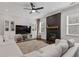 Comfortable living room with a cozy fireplace, built-in shelving, and a large sectional sofa at 7382 Gossamer St, Union City, GA 30291