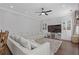 Spacious living room featuring a large sectional sofa, built-in shelving, and a plush area rug at 7382 Gossamer St, Union City, GA 30291