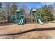 Community playground featuring slides, climbing structures, and a wood chip ground cover at 7382 Gossamer St, Union City, GA 30291