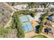 Aerial shot of a community with tennis courts and mature trees at 7382 Gossamer St, Union City, GA 30291