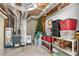 Unfinished basement with storage shelves and an exposed ceiling with ductwork at 1026 Wellesley Crest Dr, Woodstock, GA 30189