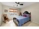 Cozy bedroom with a queen-sized bed and a rocking chair at 1026 Wellesley Crest Dr, Woodstock, GA 30189
