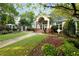 Inviting clubhouse with well-manicured lawn and a welcoming entrance featuring a covered porch at 1026 Wellesley Crest Dr, Woodstock, GA 30189
