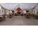 Spacious clubhouse interior with fireplace, multiple tables and chairs, and large windows at 1026 Wellesley Crest Dr, Woodstock, GA 30189