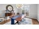 Elegant dining room featuring a chandelier, hardwood floors, and natural light at 1026 Wellesley Crest Dr, Woodstock, GA 30189
