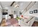 Cozy living room features built-in shelving, a fireplace, vaulted ceiling and a hardwood floor at 1026 Wellesley Crest Dr, Woodstock, GA 30189