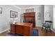 Cozy office space with wooden furniture, built in shelving and natural light at 1026 Wellesley Crest Dr, Woodstock, GA 30189