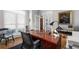 Bright office with a large wooden desk, hardwood floors, and shuttered windows at 1026 Wellesley Crest Dr, Woodstock, GA 30189