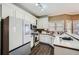 Bright kitchen featuring modern appliances, ample cabinet space and counter seating at 2836 Springrock Way, Lawrenceville, GA 30043