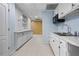 Basement kitchenette with white cabinets, marble counters, and plenty of storage space at 3410 Kates Way, Duluth, GA 30097