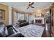 Inviting living room with a fireplace, large windows, and plush seating at 3410 Kates Way, Duluth, GA 30097