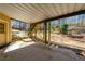 Covered outdoor patio providing shade and access to the backyard and stairs at 3410 Kates Way, Duluth, GA 30097
