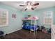 Bedroom with bunk bed, a large window, and light-colored walls at 146 Crowell Se Rd, Conyers, GA 30094