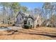 Beautiful two-story home with a three-car garage, and inviting entryway, nestled in a tranquil, wooded lot at 146 Crowell Se Rd, Conyers, GA 30094