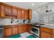 Well-equipped kitchen with wooden cabinets, granite countertops, and stainless steel appliances at 146 Crowell Se Rd, Conyers, GA 30094