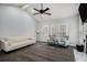 Living room featuring vaulted ceilings, ceiling fan, a fireplace, and ample natural light at 146 Crowell Se Rd, Conyers, GA 30094
