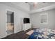 Main bedroom showcasing en-suite bath with large soaking tub, adjacent to large windows and carpeting at 146 Crowell Se Rd, Conyers, GA 30094