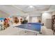 Basement area with a ping pong table and ample room for activities at 2287 Lake Ridge Ter, Lawrenceville, GA 30043