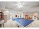 Finished basement featuring a ping pong table, storage, and recreational space at 2287 Lake Ridge Ter, Lawrenceville, GA 30043