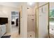 A shower and tub sit adjacent to the bedroom in this ensuite bath at 2287 Lake Ridge Ter, Lawrenceville, GA 30043