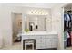 This bathroom has a vanity with a mirror, drawers, and a separate toilet at 2287 Lake Ridge Ter, Lawrenceville, GA 30043