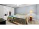 Comfortable bedroom with two beds and doorway to another room at 2287 Lake Ridge Ter, Lawrenceville, GA 30043