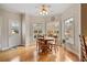 Cozy dining area with hardwood floors, three windows, and access to the outdoor deck at 2287 Lake Ridge Ter, Lawrenceville, GA 30043