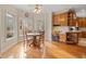 Bright dining area with hardwood floors, a ceiling fan, and three windows providing ample natural light at 2287 Lake Ridge Ter, Lawrenceville, GA 30043