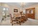 Spacious dining room with a wooden dining table, chandelier, and ample natural light at 2287 Lake Ridge Ter, Lawrenceville, GA 30043