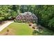 Lovely two-story brick home with landscaped front yard and mature trees in a beautiful community at 2287 Lake Ridge Ter, Lawrenceville, GA 30043