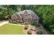 Beautiful two-story brick home with well-manicured landscaping and a basketball court at 2287 Lake Ridge Ter, Lawrenceville, GA 30043