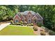 Charming brick home with manicured landscaping and an inviting entrance, offering curb appeal and charm at 2287 Lake Ridge Ter, Lawrenceville, GA 30043