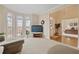 Inviting living room with large windows providing ample natural light at 2287 Lake Ridge Ter, Lawrenceville, GA 30043