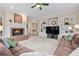 Inviting living room features a fireplace, built-in shelving, and a comfortable sectional sofa at 2287 Lake Ridge Ter, Lawrenceville, GA 30043