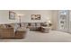 Comfortable living area featuring a large sectional sofa and neutral decor at 2287 Lake Ridge Ter, Lawrenceville, GA 30043