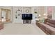 Living room with custom shelving, comfortable seating, and a view into other rooms at 2287 Lake Ridge Ter, Lawrenceville, GA 30043