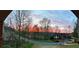 Picturesque street view at dusk with stunning sunset over the lake at 2287 Lake Ridge Ter, Lawrenceville, GA 30043