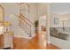 Spacious foyer showcasing a staircase with wood handrail, and view to dining room at 2287 Lake Ridge Ter, Lawrenceville, GA 30043