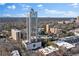 Stunning aerial view of a modern high-rise condominium with a beautiful cityscape backdrop on a sunny day at 2828 Peachtree Nw Rd # 1402, Atlanta, GA 30305