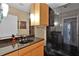 Modern bathroom boasts black granite countertop, glass shower, and sleek design for an upscale experience at 2828 Peachtree Nw Rd # 1402, Atlanta, GA 30305